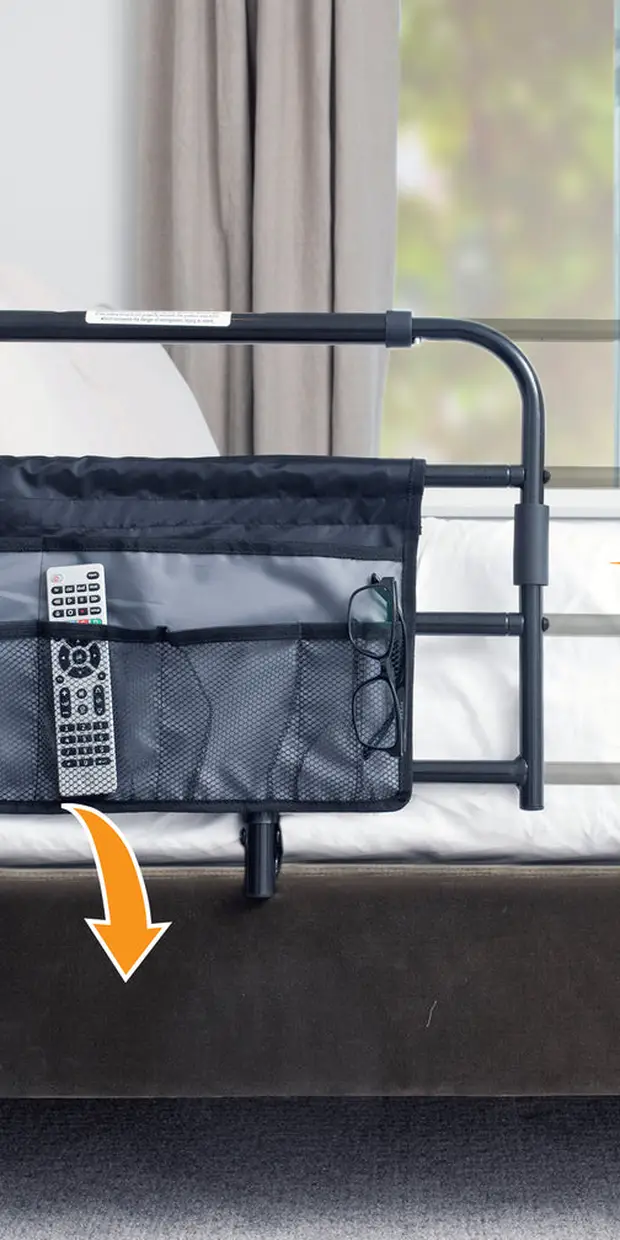 The Stander Wonder Pivot Bed Rail in black, a steel bed rail with padded handle and organizer pouch